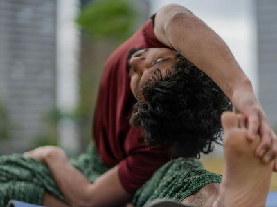 Close-up of a deep stretching pose, highlighting flexibility.